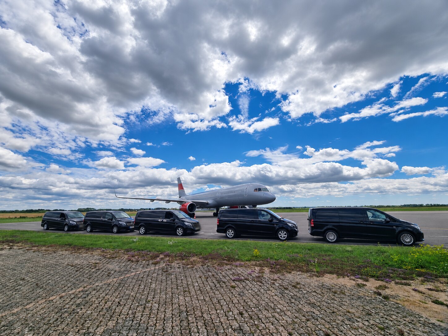 Professional vehicle convoy at an airport